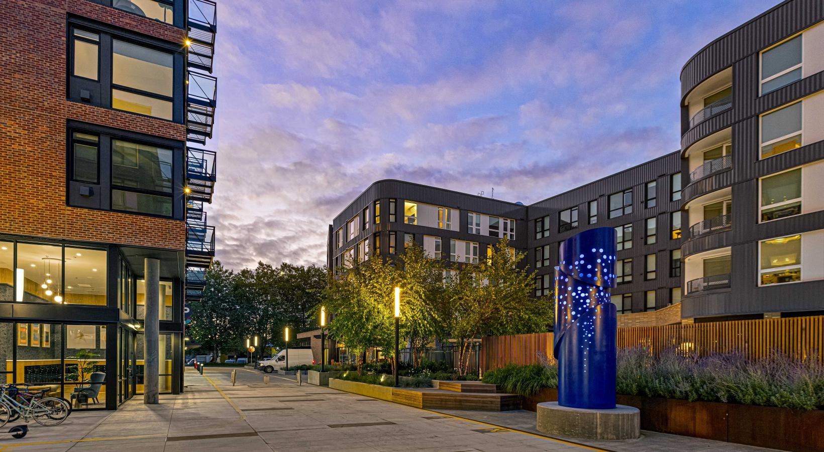Settle into comfort at Spectra a courtyard between buildings