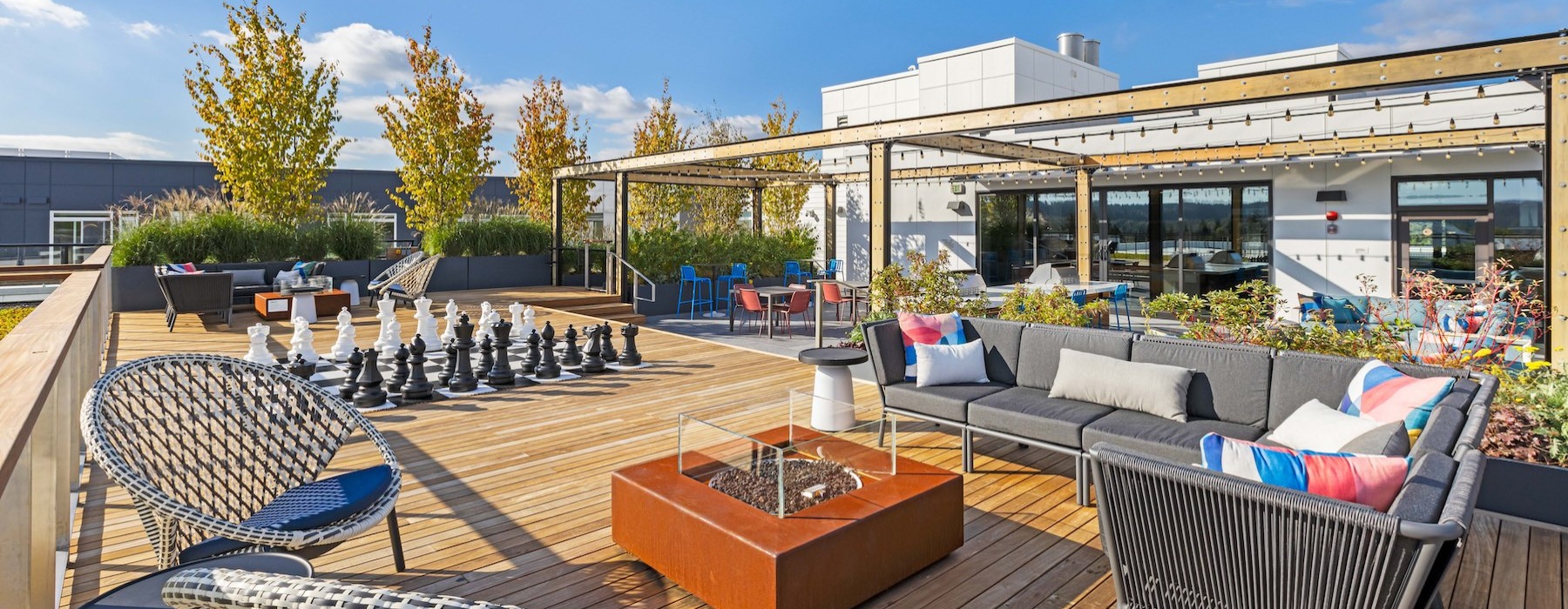 a patio with a pool and chairs