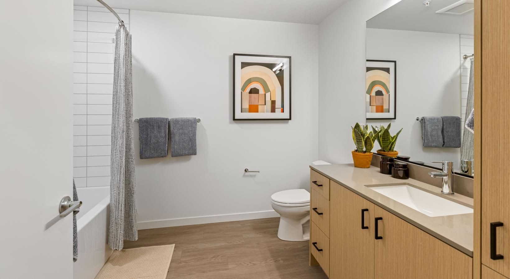 Bathroom options with thoughtful details a bathroom with a sink toilet and mirror