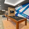 a pool table in a clubhouse room
