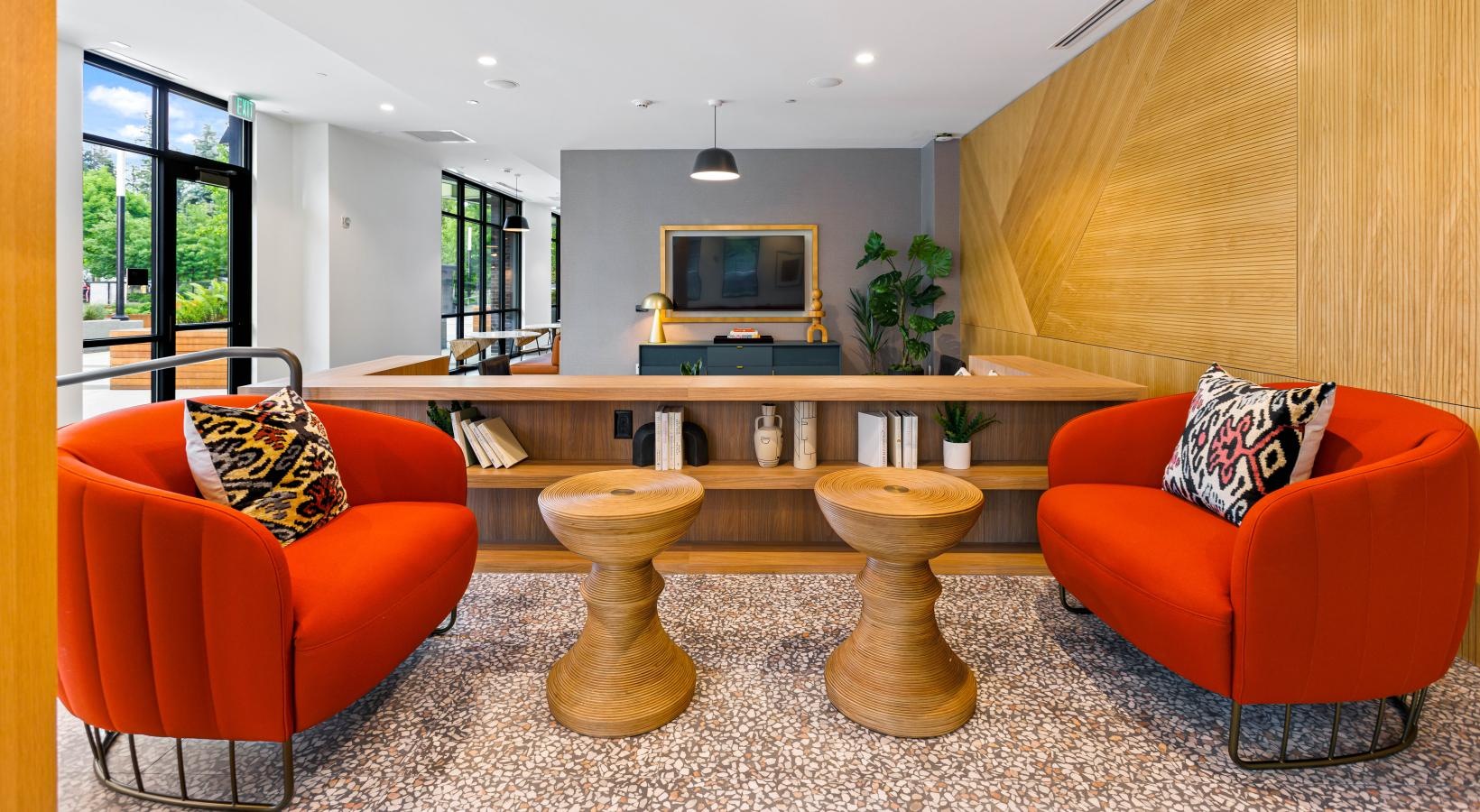 Everything within reach a living room with orange chairs