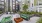 a courtyard with chairs and tables