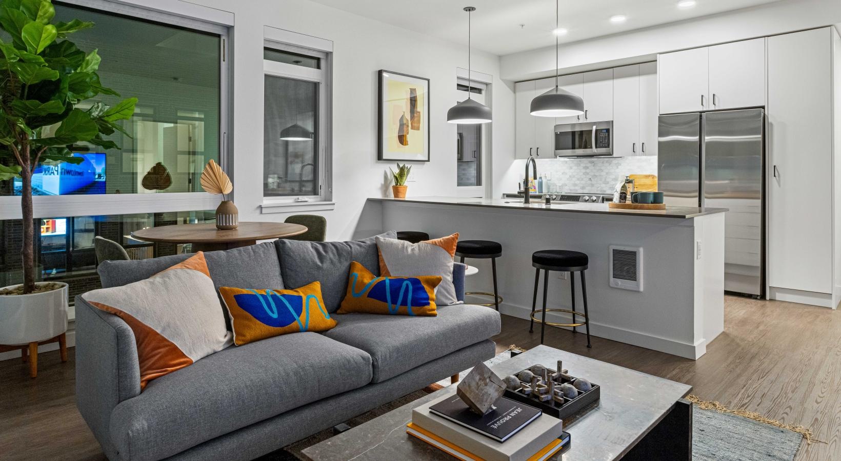 Spacious living areas to recline and recharge a living room with a couch and a table