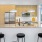 a kitchen with a bar stools