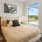 a bedroom with a large window