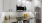 a kitchen with white cabinets