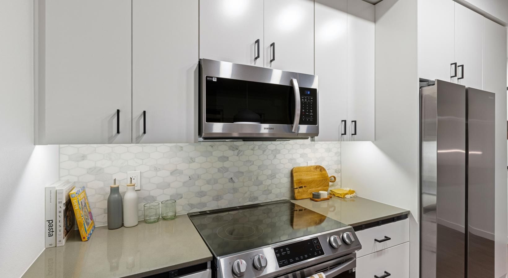 Spacious kitchens with thoughtful details a kitchen with white cabinets
