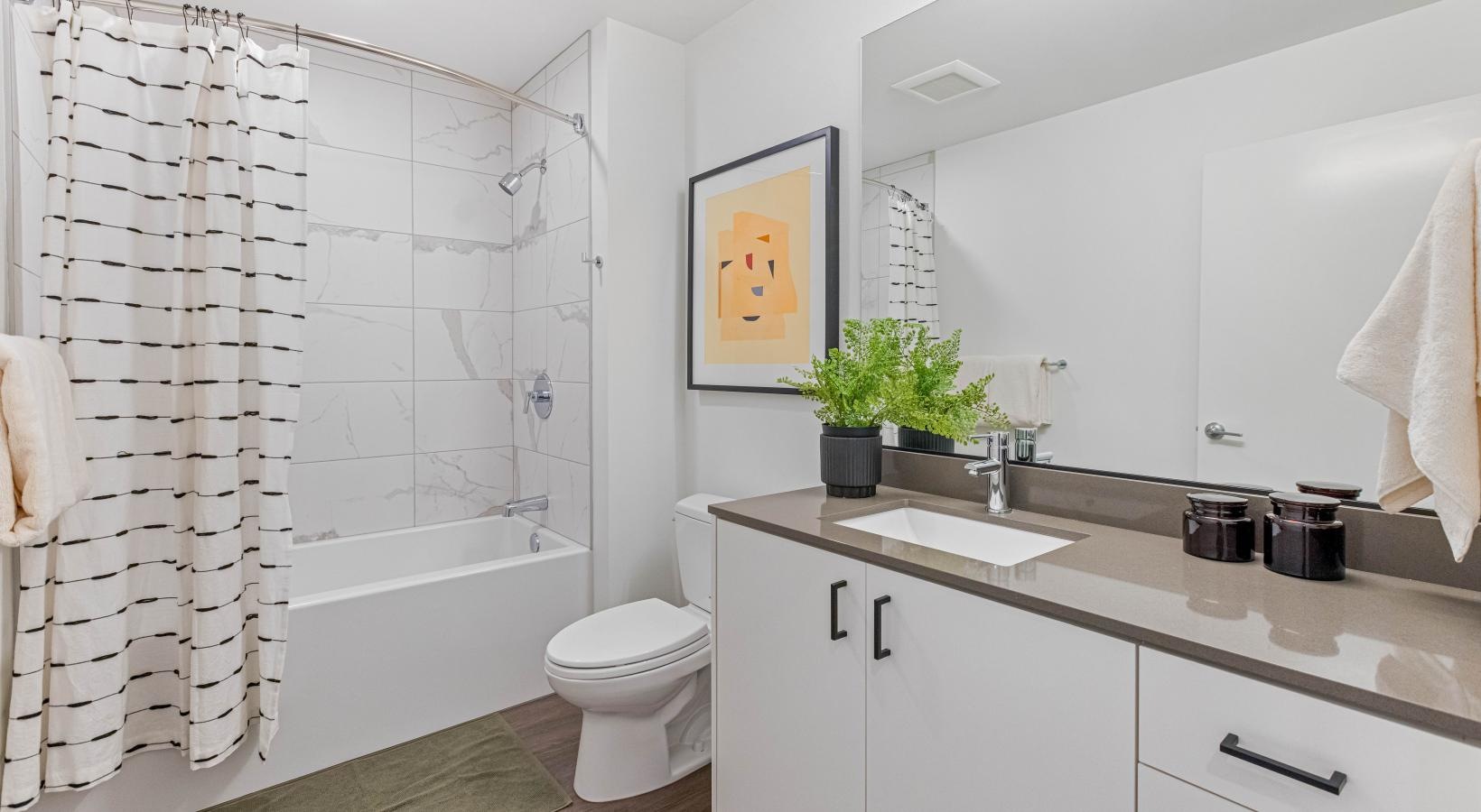 Bathroom options with thoughtful details a bathroom with a tub sink and toilet