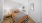 a bedroom with a bed and a mirror