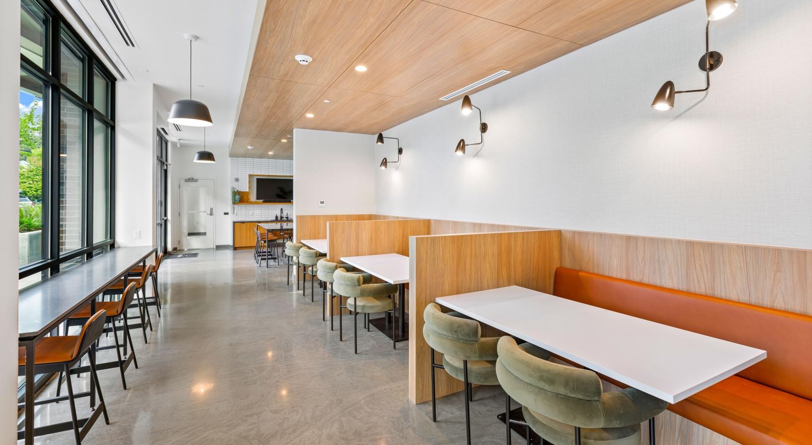 Enjoy our resident-only features a room with tables and chairs