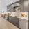 a kitchen with black cabinets